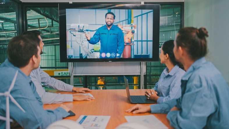 A team of Engineer sitting in the office having a video call