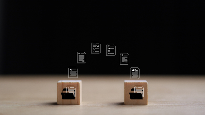 Wooden blocks with virtual document loading to another folder. Data copy or move. Transfer files of data between folders. Exchange of file on folder. Send document to the internet.